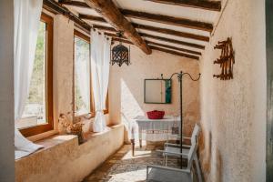 a room with a table and chairs in a building at Villa Dufour Berte in Londa +27 photos