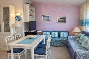 a living room with a couch and a table at Casa Lucia vicino al mare in Budoni