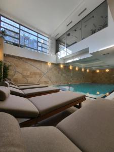 a living room with a swimming pool in a house at Apartamenty Nautilus in Świnoujście