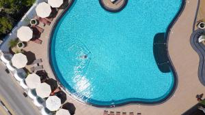 an overhead view of a swimming pool at a resort at Rocks Hotel & Casino in Kyrenia