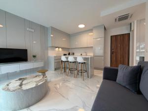a living room with a couch and a kitchen at Miris Mora in Rafailovici