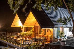 a house with a porch with plants on it at The Bougainvillea Retreat in Dehradun