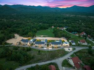 an aerial view of a house in the middle of a road at House Degenia in Lovinac +12 photos