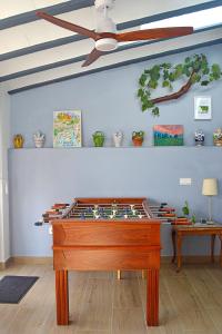 a pool table in a room with a ceiling fan at La Vieja Parra in La Puerta de Segura