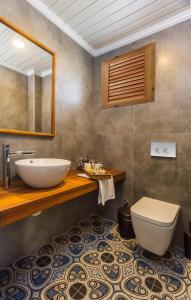 a bathroom with a sink and a toilet at Müptela Alaçatı in Çeşme +61 photos