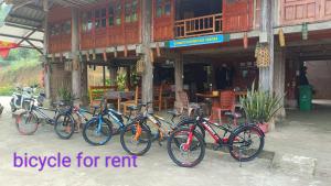 a group of bikes parked in front of a building at GiangTien Homestay ThacBa - Bungalow in Yên Bình