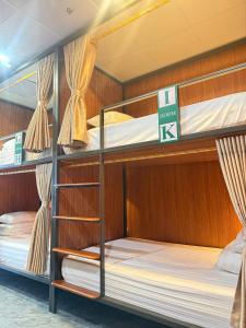 a group of bunk beds in a boat at The Sun Backpacker Hostel in Ninh Binh