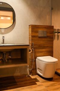 a bathroom with a toilet and a sink at The Hue House in Sibsāgar
