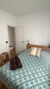a bedroom with a bed with two pillows on it at VUT Torreón de los Guzmanes in Ávila +64 photos