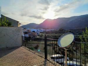 a mirror on a fence with a view of a mountain at Ca Les Senyoretes in Otos