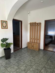 an empty room with a room with a couch at Viktor Apartmanház in Zamárdi