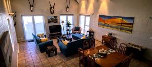 a living room with a couch and chairs and a table at The Gables in Grotto Bay
