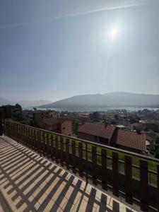 a view of a city from a balcony at La Dimora del Lago d'Iseo in Sarnico +1 photo