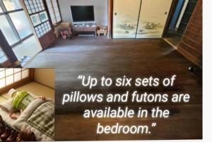 a picture of a child laying on the floor in a room at ゲストハウス　竹亭 in Marugame +33 photos