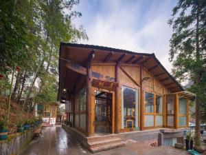 a house that is being built in the woods at Astria Moruo Retreat in Xinglong +14 photos