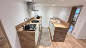 a kitchen with a stove and a counter top at Ferienwohnung Nella in Paderborn +15 photos