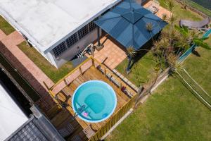 an overhead view of a swimming pool in a backyard at Cozy house with sea view! in Luquillo +37 photos