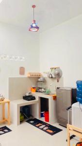 a kitchen with a counter and a sink in a room at The Heaven Luxe Pangandaran in Pangandaran