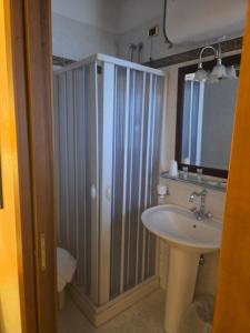 a bathroom with a shower and a sink at Hotel Ristorante Rinelli in Margherita di Savoia +122 photos