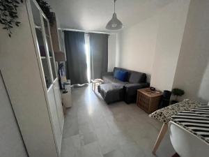 a living room with a couch and a table at Malaga Mijas Costa Pool Nuevo Piso in Mijas Costa