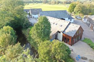 an aerial view of a group of houses and trees at Happy Horse Cottages in Sennybridge