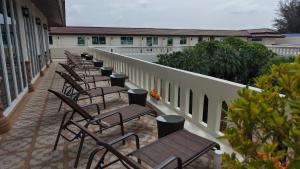 a row of chairs sitting on a balcony at Quality Beach Resorts and Spa Patong in Patong Beach