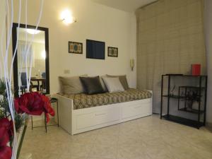 a living room with a bed in a room at Civico 55 in Casale Torre San Giovanni
