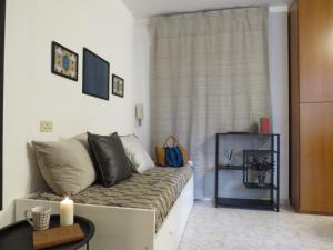 a living room with a couch and a window at Civico 55 in Casale Torre San Giovanni