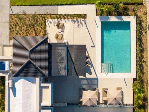 an overhead view of a house with a swimming pool at Mama Rosa Luxury Villas with private pools in Zipárion