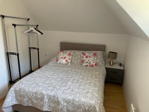 a bedroom with a bed with two pillows on it at Evergreen Sokolina in Rača