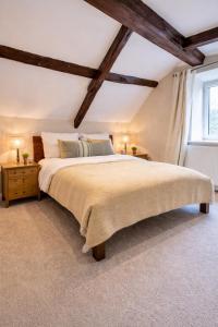 a bedroom with a large bed and a window at The loft in Cirencester