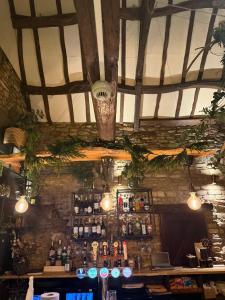 a bar in a pub with aperature at The loft in Cirencester +16 photos