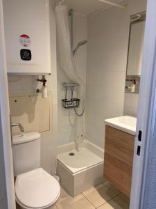a small bathroom with a toilet and a sink at Studio Tignes Val Claret in Tignes