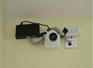 a camera is hooked up to a charger at V3 Inn Private Limited in kolkata