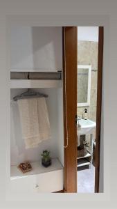a bathroom with a sink and a towel at Monoambiente centrico-Paseo Plaza in Navarro +2 photos