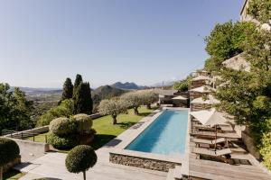 an image of a villa with a swimming pool at Boutique Hotel NOAE by Emerald Stay in Oletta