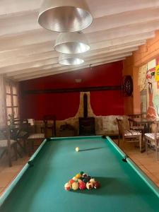 a pool table with balls on it in a room at Bed Breakfast - Casa Rural in Úbeda