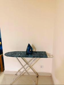a table with a blue item on top of it at Pakhir Basha in Dhaka