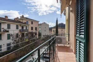 a balcony with a view of a city at House Tuscany in Poggibonsi
