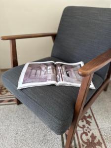 a magazine sitting on top of a chair at F Home in Noto +37 photos