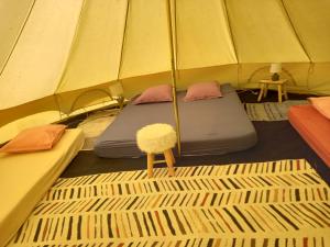 a room with two beds in a tent at camping de brocéliande in Néant-sur-Yvel +17 photos
