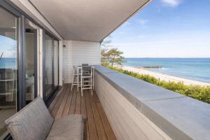 a balcony with a view of the beach at Ostsee Suite 3 - Strandperle in Niendorf