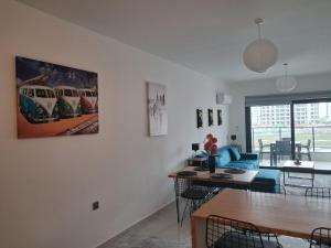 a living room with a painting of a train on the wall at Fabius 12 Caesars Resort & Spa in Iskele