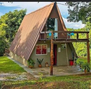 a house with a gambrel roof with a balcony at Galoya Cool Cool Hotel in Ampara
