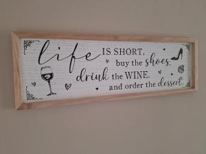 a sign that says life is short buy the shoes drink the wine and order at Fieldside House Beautiful Sleeps 6 House with Decked Garden in Scarborough