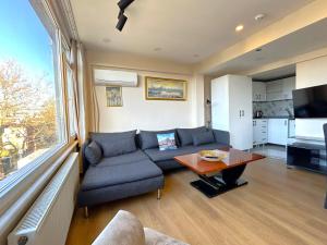 a living room with a couch and a table at Kuzguncuk View in Istanbul
