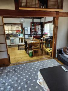 a living room with a table and a dining room at 玉の浦sea in Nachikatsuura