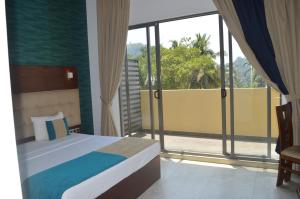 Llit o llits en una habitació de Avanee Hotel 79 fotos més
