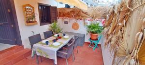 a patio with a table and chairs at Charming House with Boho terrace in Chayofa