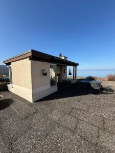 a small building with a table on a roof at Urlaub am Bodensee in Staad - einmalige Seesicht in Staad +13 photos